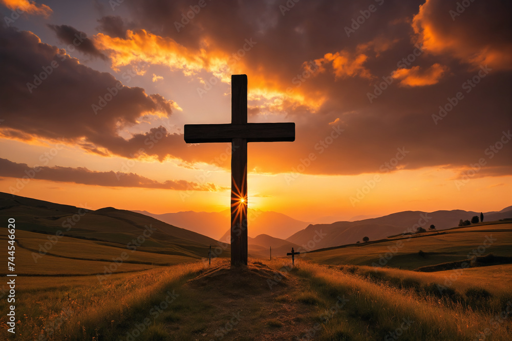Sunset behind cross in epic landscape Sunset behind cross in epic landscape
