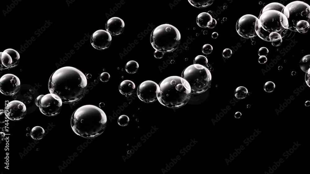 motion of large water bubbles falling on a black background motion of large water bubbles falling on a black background