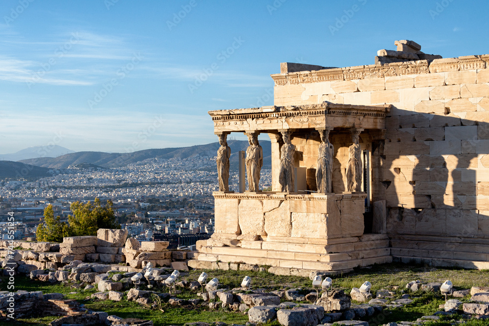 Porch of the Caryatids with city view of Athens in the background