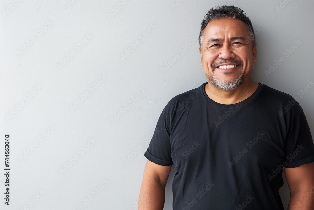 Friendly Middle-Aged Man with a Confident Smile Wearing a Casual Black T-Shirt Friendly Middle-Aged Man with a Confident Smile Wearing a Casual Black T-Shirt