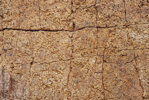 Rock surface with cracks. Natural rock structure. Rock texture. Surface of Wild Stone