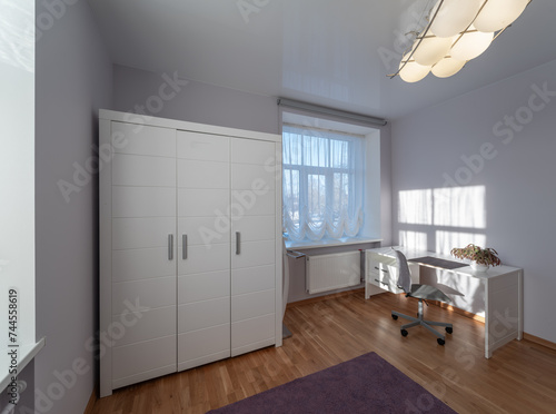 Living room in the modern flat. Lighti from th ewindow.