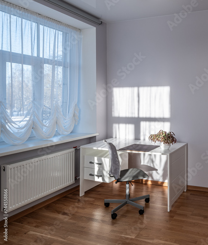 Living room in the modern flat. Lighti from th ewindow.