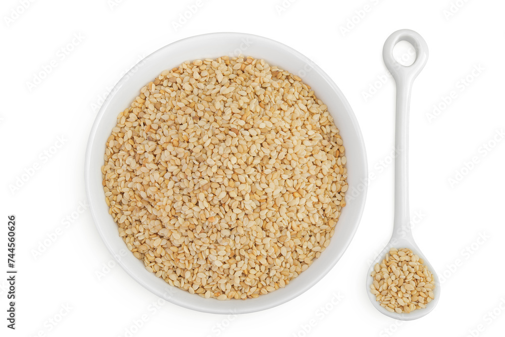 Sesame seeds in ceramic bowl and spoon isolated on white background. Top view. Flat lay Sesame seeds in ceramic bowl and spoon isolated on white background. Top view. Flat lay