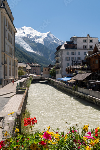The Arve River, an alpine stream running through the popular ski resort, with Mont Blanc mountain in the background, Chamonix, Haute Savoie, Auvergne Rhone Alpes, France