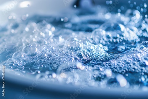 Close-up of the rushing water. Foamy, blue water. Macro photography.