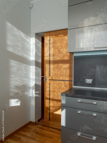 KItchen in the modern flat. Light from the window.