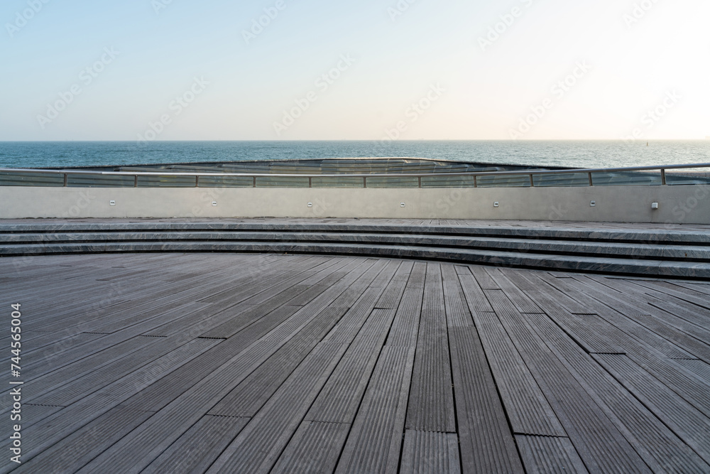 empty wooden floor  with tranquil  seascape during sunrise.
