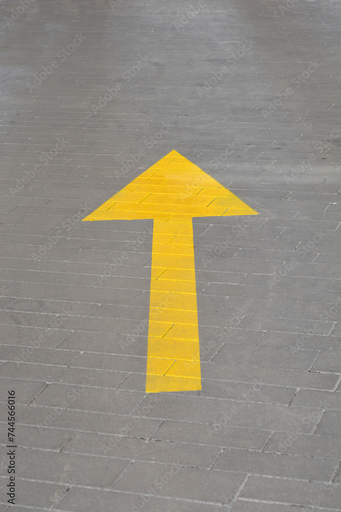 Yellow arrow indicating direction for traffic Yellow arrow indicating direction for traffic