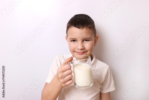 The boy tasted delicious milk. Children's healthy food.