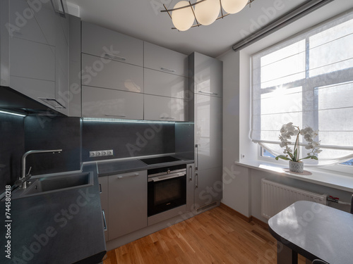 KItchen in the modern flat. Light from the window.