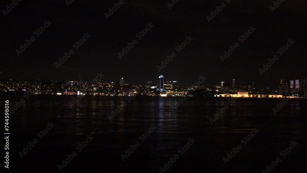 Walking along the Bosporus at night towards July 15 Martyrs Bridge