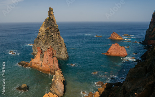 Red rock pillar protruding out of the Atlantic Ocean at the Ponta de São Lourenço (tip of St Lawrence) at the easternmost point of Madeira island (Portugal) photo