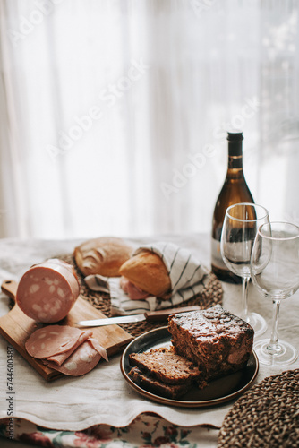 tavola con pranzo italiano con panino con mortadella e dolce tipico Bolognese photo