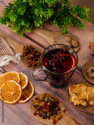 mug with mulled wine on wooden background