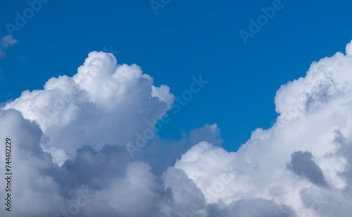 Beautiful bright blue sky with fluffy white clouds.