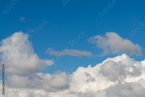 Beautiful bright blue sky with fluffy white clouds.