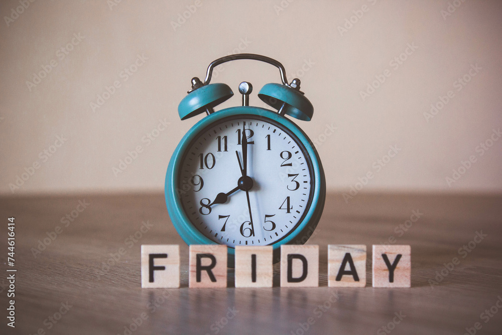 alarm-clock with friday letters. friday meeting. daily meeting. plan for friday. friday workday. vintage alarm-clock. Retro style. time management concept. Daily plan concept. close-up of alarm. alarm-clock with friday letters. friday meeting. daily meeting. plan for friday. friday workday. vintage alarm-clock. Retro style. time management concept. Daily plan concept. close-up of alarm.