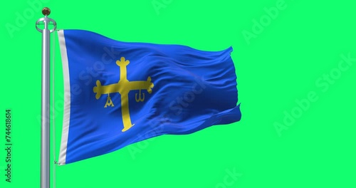 The Asturias flag waving isolated on green background photo