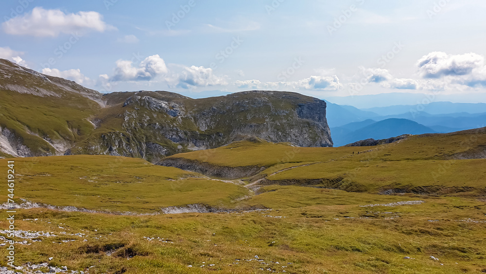 Panoramic view of majestic mount peaks of Hochschwab massif, Styria, Austria. Idyllic hiking trail on high altitude alpine meadow, remote Austrian Alps in summer. Massive rock formation Stangenwand