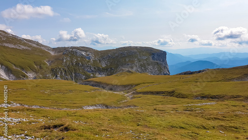 Panoramic view of majestic mount peaks of Hochschwab massif, Styria, Austria. Idyllic hiking trail on high altitude alpine meadow, remote Austrian Alps in summer. Massive rock formation Stangenwand