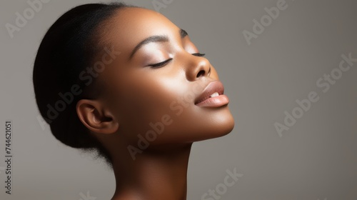 Skincare model portrait. Beauty spa treatment concept. Young girl posing with closed eyes against grey backdrop