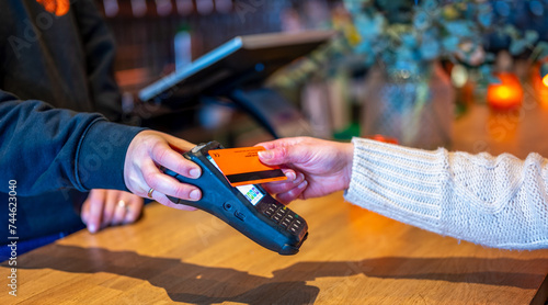 Customer using card on pos machine.