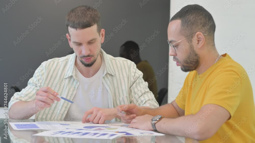 Multi Ethnic People Working on Documents Multi Ethnic People Working on Documents