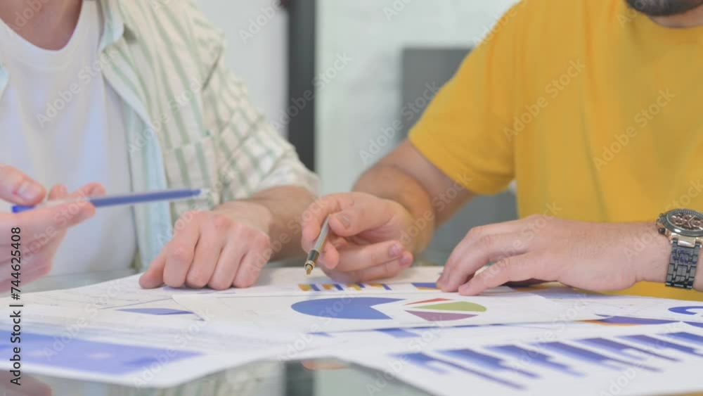 Close up of Male Hands Working on Documents Close up of Male Hands Working on Documents