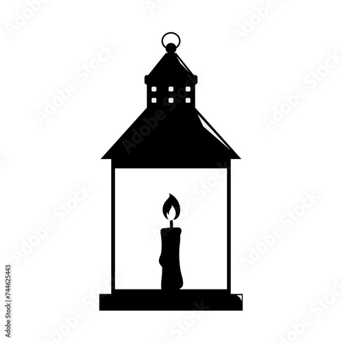 silhouette of a lantern with a burning candle