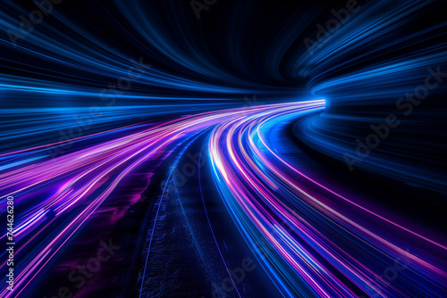 Abstract Light Trails in Motion on Dark Background. Long exposure image capturing the vibrant motion of light trails in blue and pink hues against a stark black backdrop.