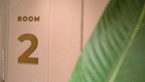 white door indicating room number two