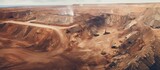 Aerial perspective of sand open-pit mining, with blurriness and distracting noise.