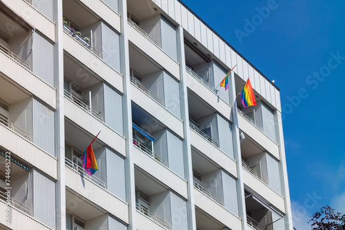 Pride Flags hang from the balconies of an apartment building in Bergen, Norway