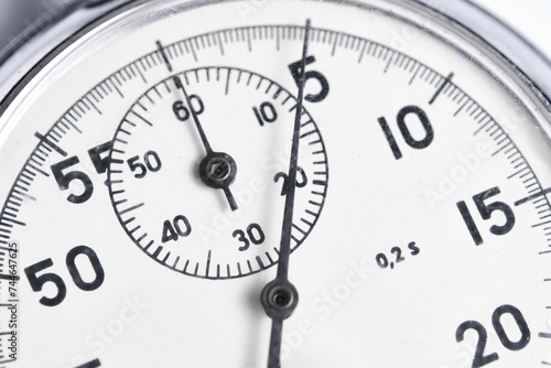 Mechanical stopwatch white background closeup.