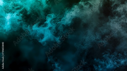 Dense multicolored smoke of blue and green colors on a black isolated background