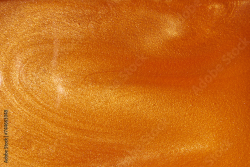 Liquid gold shimmer, fashion cosmetics, glittering background, beauty shine