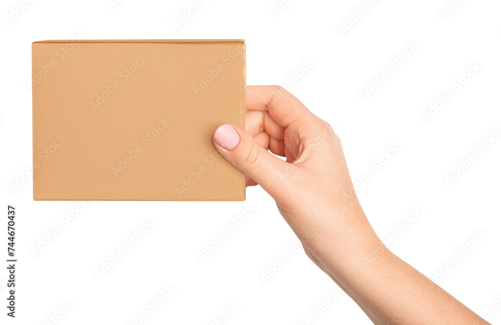 A woman's hand holds a cardboard box on an empty background.
