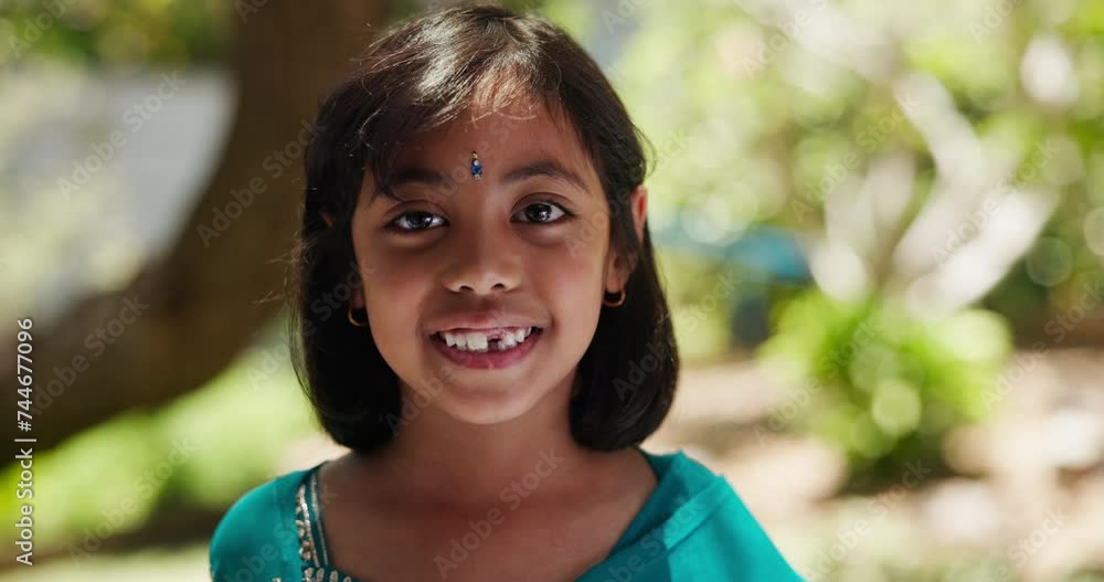 Indian child, portrait and smile in garden for traditional, fashion and style in Dubai. Hindu girl, face and happy outdoors with dress for natural beauty, cultural and clothes for proud heritage Indian child, portrait and smile in garden for traditional, fashion and style in Dubai. Hindu girl, face and happy outdoors with dress for natural beauty, cultural and clothes for proud heritage