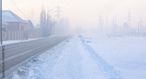 high power lines in the fog in winter 