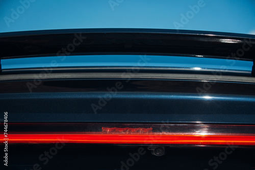 Active aerodynamic system spoiler on the trunk of modern car © Moose