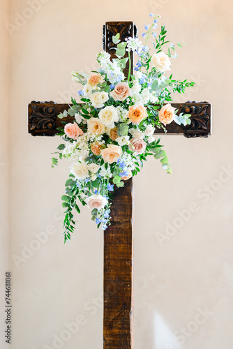 floral arrangement on cross