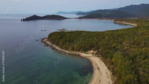 Wallpaper Mural Island oasis in ocean with lush trees, surrounded by water and natural beauty Torontodigital.ca