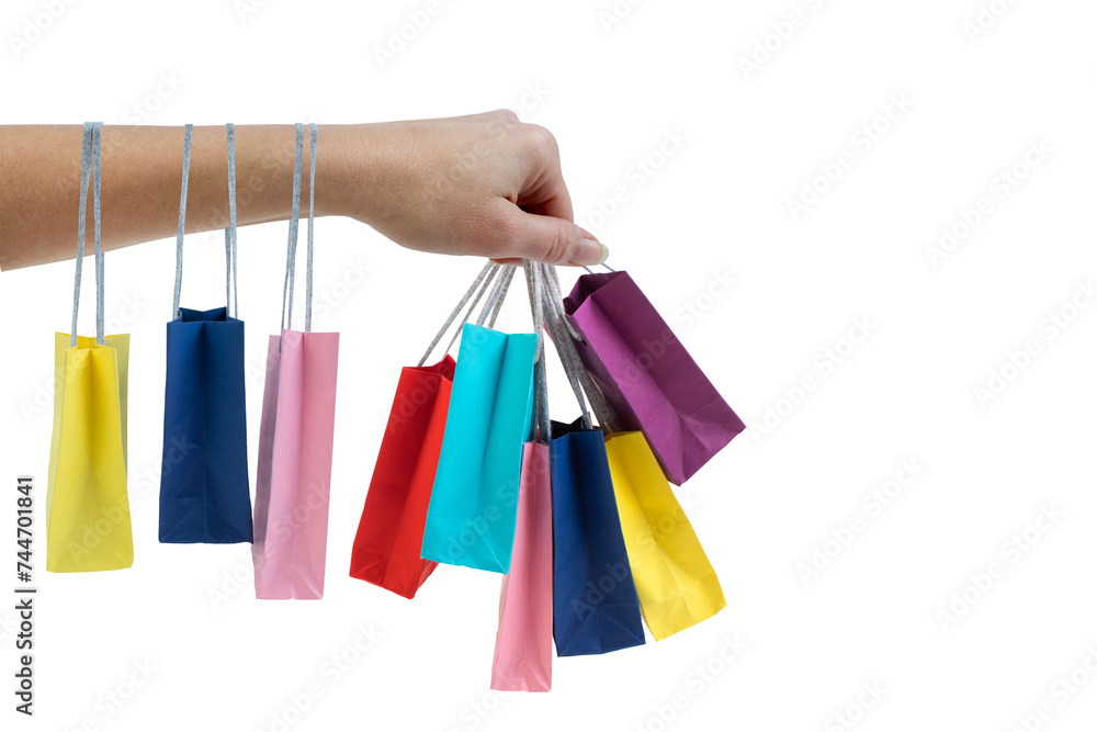 Hand holding multicolored paper bags isolated on white shopping concept. black Friday