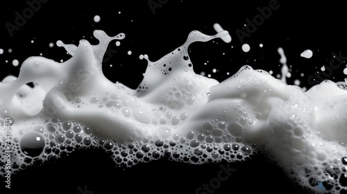 Soap foam, lather isolated on black, with clipping path, texture and background photo