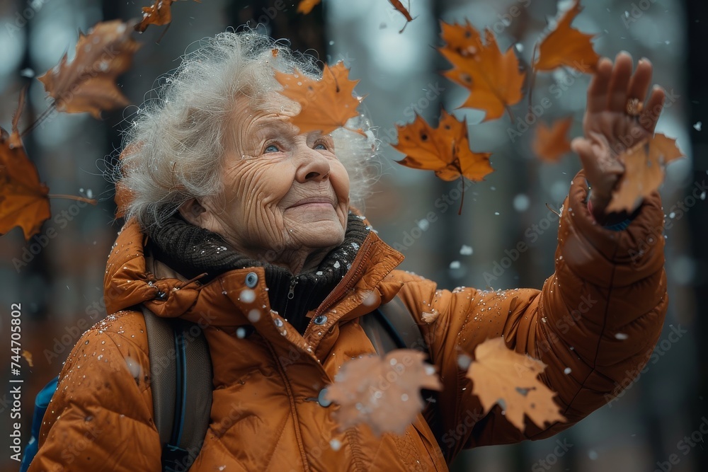 As the cool autumn breeze swept through her jacket, the woman's face lit up with joy as she playfully tossed the vibrant leaves into the crisp winter air