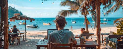 Remote Work Setup with Ocean View at Tropical Beach photo