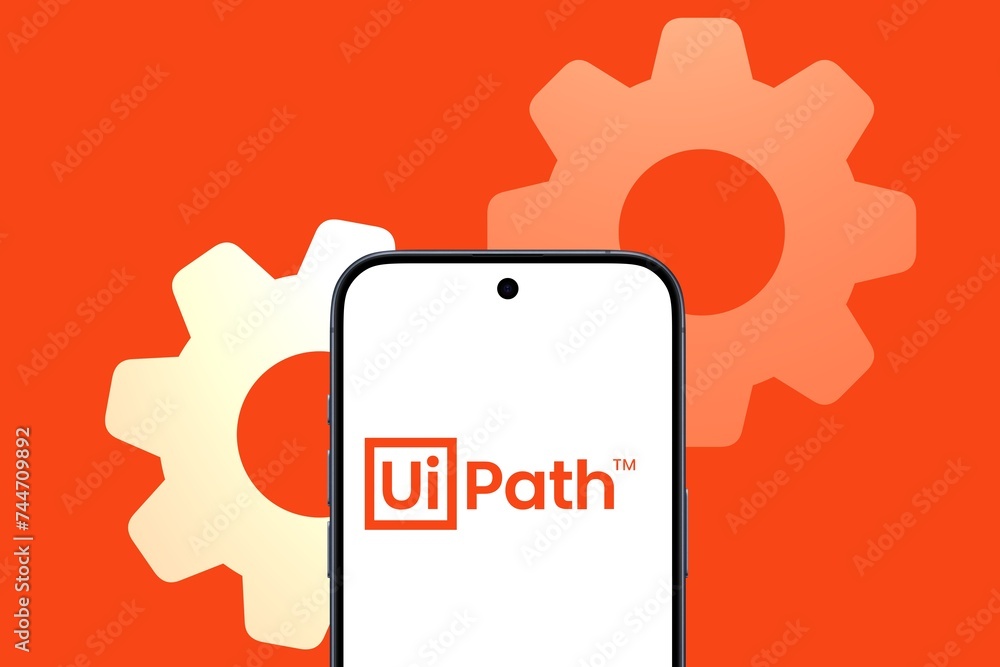 UiPath Logo is displayed on a modern smartphone, software company for ...