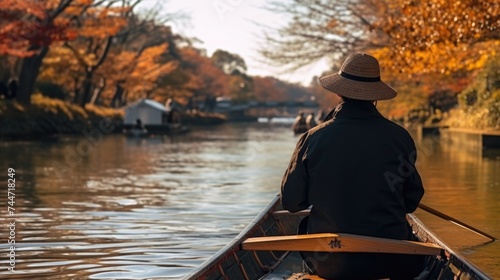 A person in a boat on a body of water. Suitable for outdoor and travel concepts