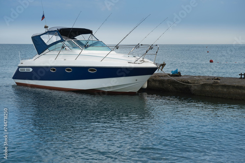 The boat is at the pier in the resort village of Nebug, Krasnodar Territory